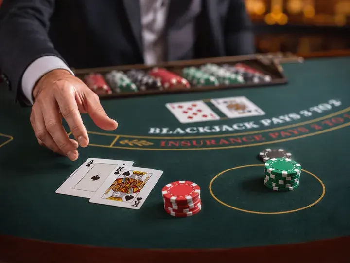 Blackjack cards and chips on casino felt